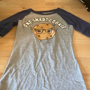 gray shirt with navy blue sleeves and a cookie in the middle EUC